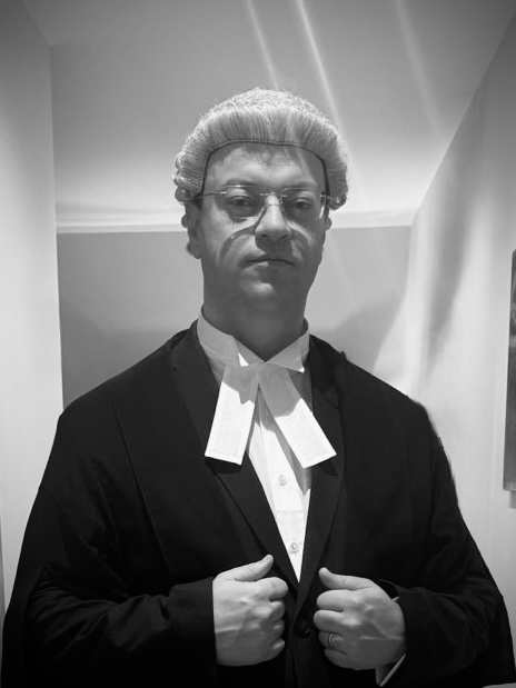 Zak Taylor in courtroom attire